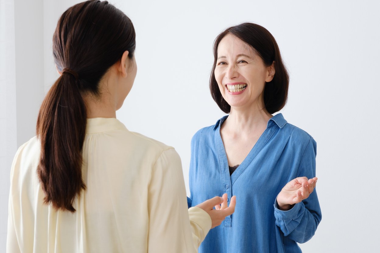 asian mother and daughter talking